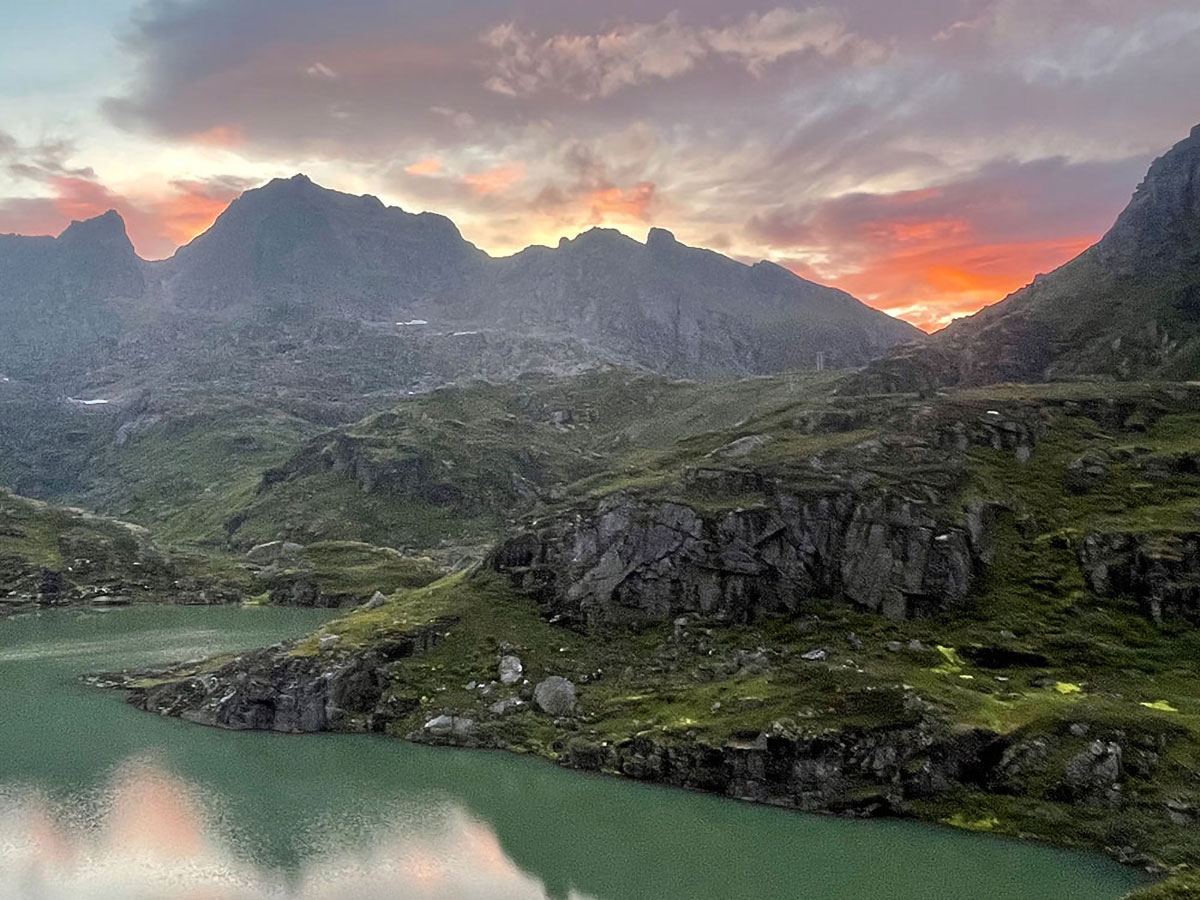 Hiking trails in Ballstad Lofoten with mountain lake and sunset views.