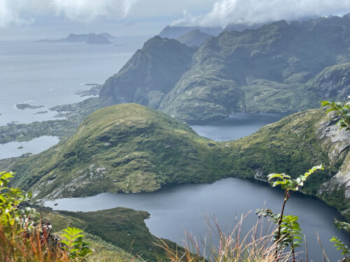 Hiking trail overlooking fjords and mountains in Ballstad, Lofoten Islands.