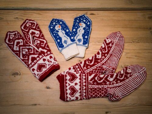 Traditional Lofoten hand-knitted wool mittens with Nordic patterns and snowman design.